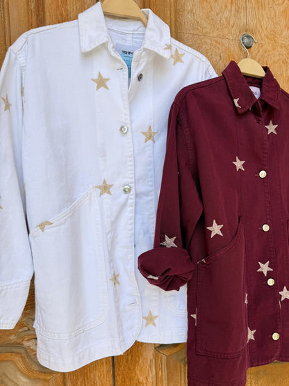 Amenaa Star Gabardine Jacket displayed on a hanger, featuring a classic design with star details and durable gabardine fabric.