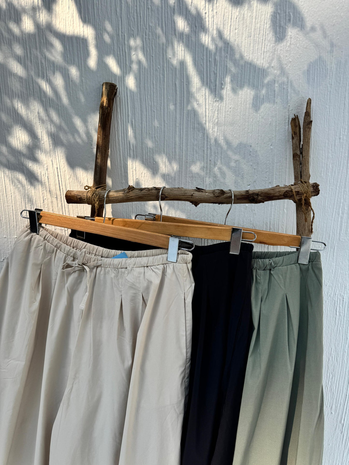 Amenaa wide leg pants in neutral fabric, featuring a relaxed fit and flowing silhouette, perfect for casual or stylish wear.