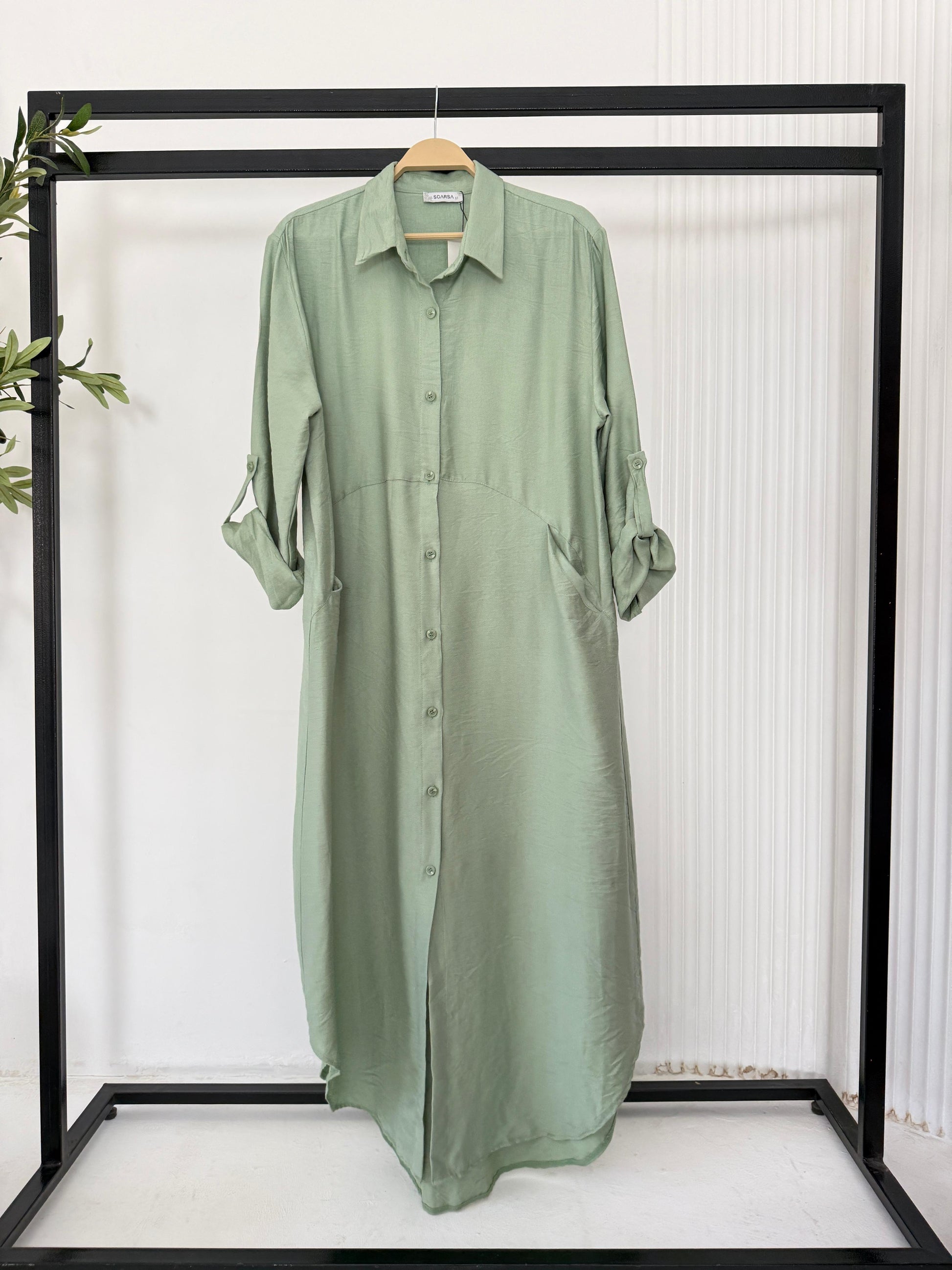 Amenaa shirt dress featuring a relaxed fit with a collar, long sleeves, and button-down front in a lightweight fabric.