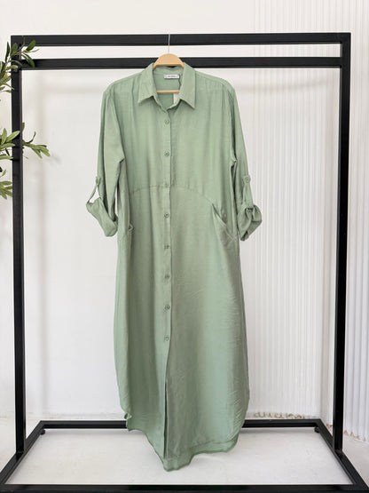 Amenaa shirt dress featuring a relaxed fit with a collar, long sleeves, and button-down front in a lightweight fabric.