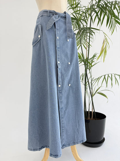 Amenaa button denim skirt with front button closure, high-waisted design, and classic blue denim fabric.