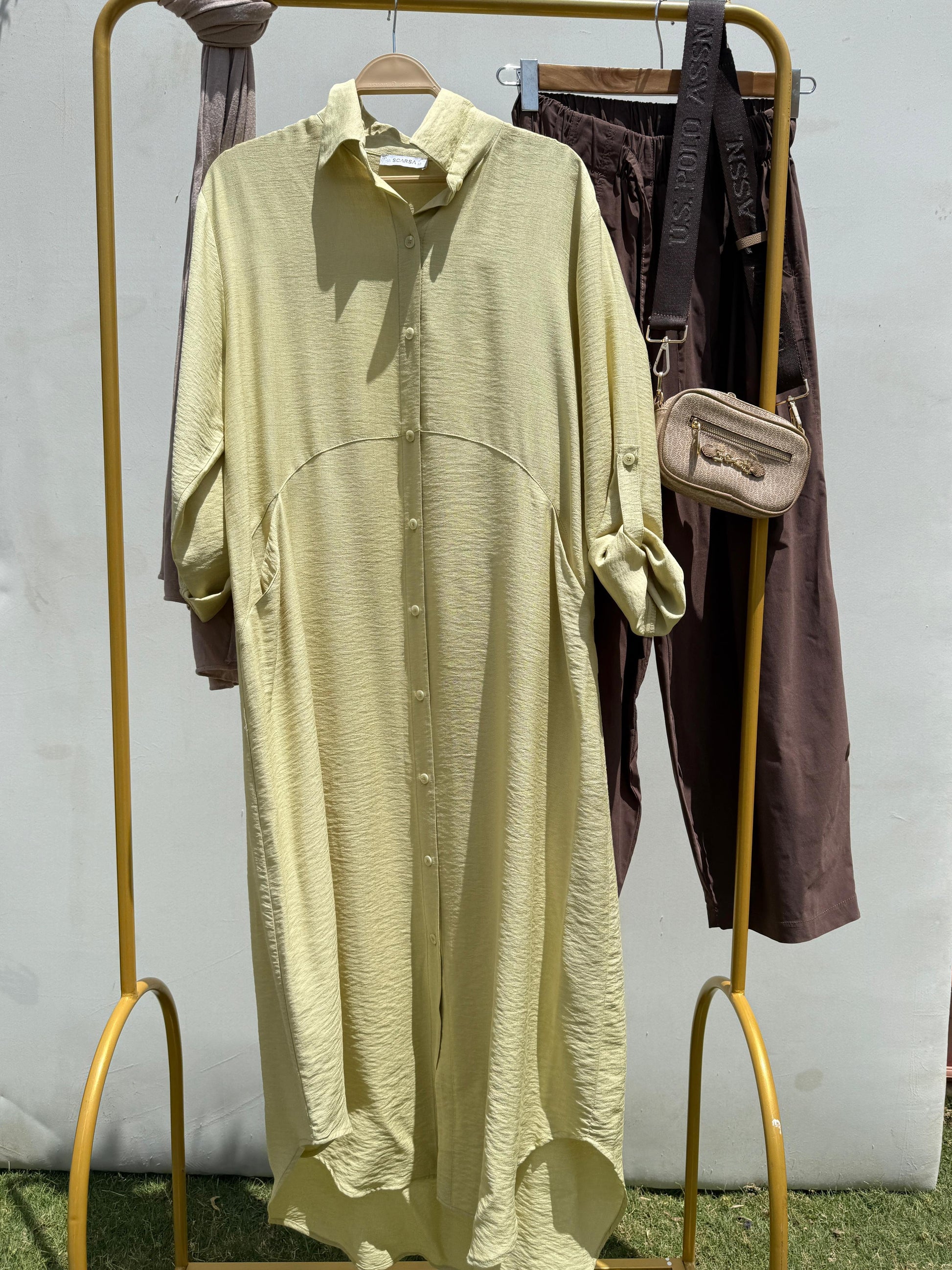 Amenaa shirt dress featuring a relaxed fit, button-down front, and stylish collar, perfect for casual or office wear.