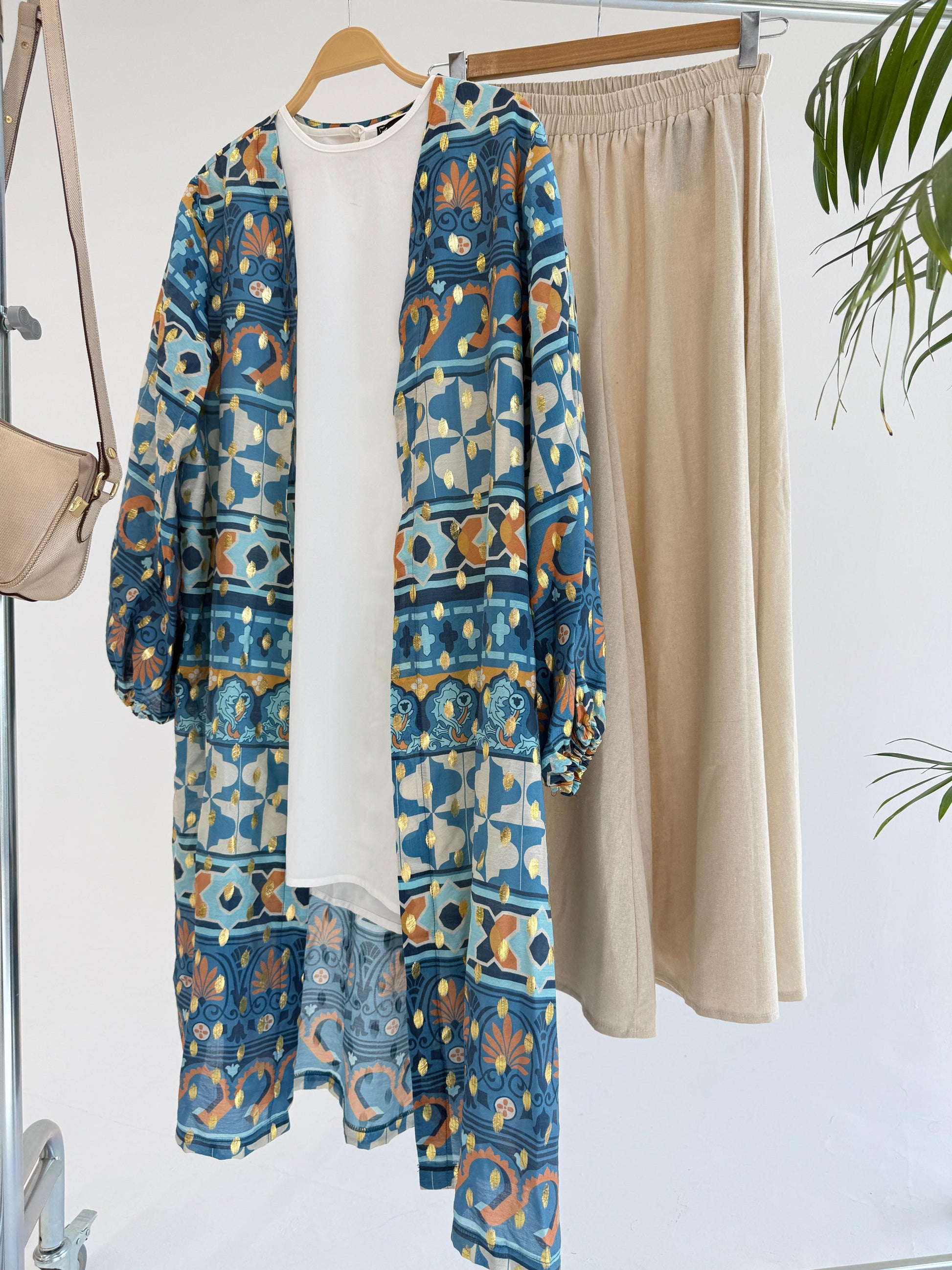Amenaa mosaic pattern kimono with vibrant geometric design, flowing fabric, and traditional Japanese-inspired style.