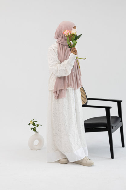 Amenaa Rokama skirt set featuring a stylish matching top and skirt in vibrant fabric, perfect for casual or semi-formal wear.