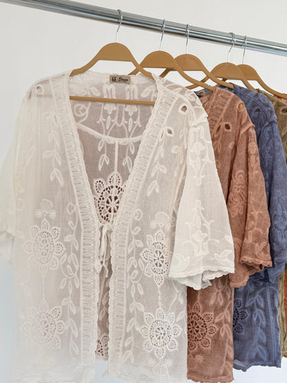 Embroidered lace Amenaa kimono with floral patterns, flowing fabric, and intricate detailing, displayed on a neutral background.