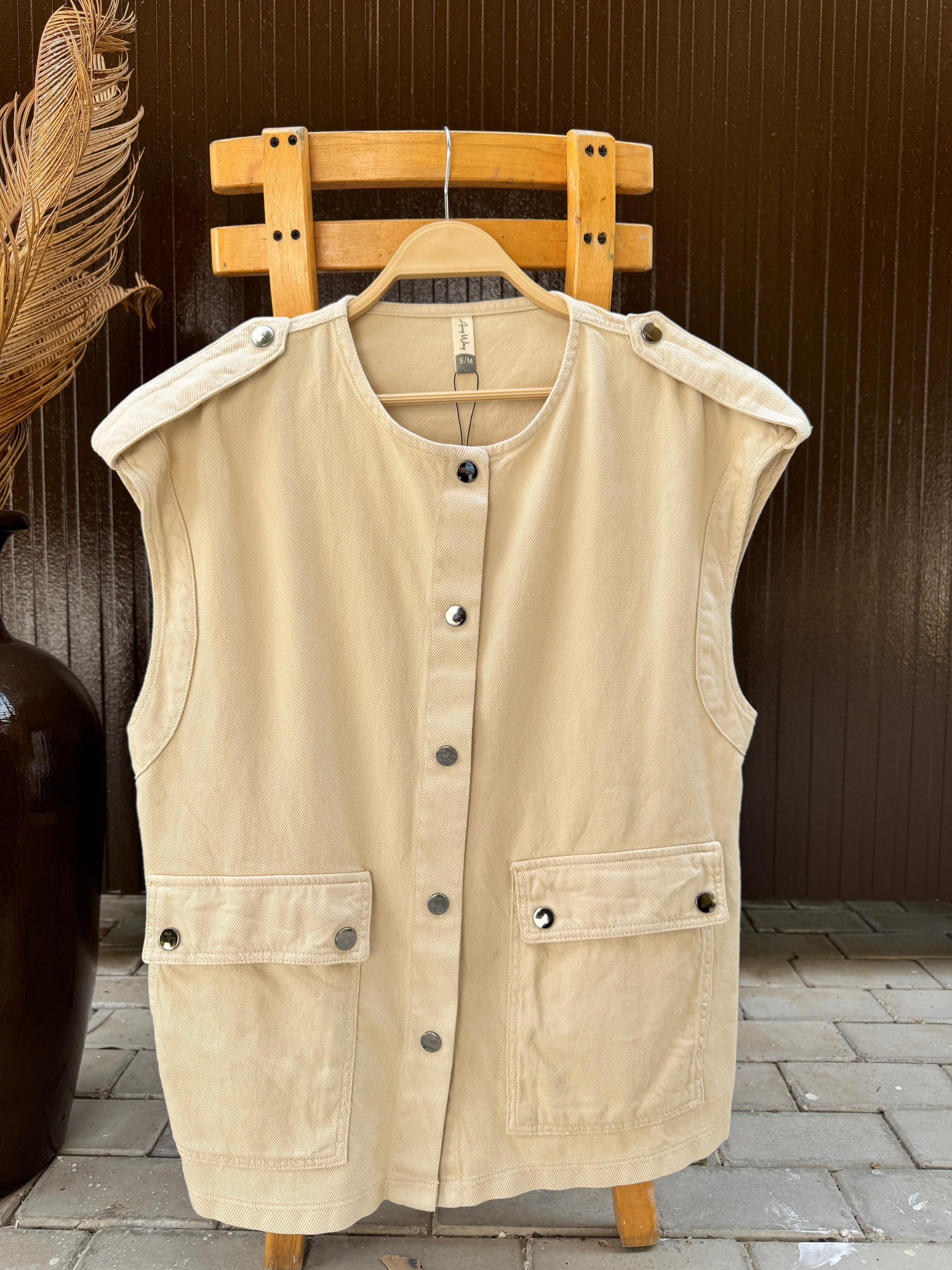 Amenaa new gabardine vest shown on a hanger, lightweight fabric with classic design and neutral color, ideal for casual or smart casual wear.
