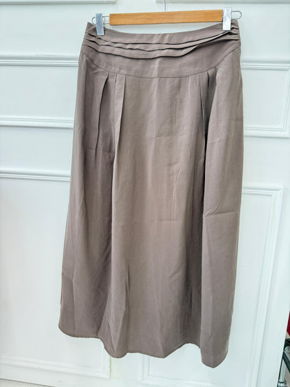 Amenaa new skirt displayed on a hanger, featuring a stylish design with a flattering fit and vibrant fabric.