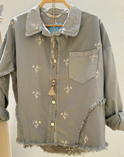 Flowery embroidered gabardine jacket by Amenaa featuring colorful floral embroidery and tailored fit.