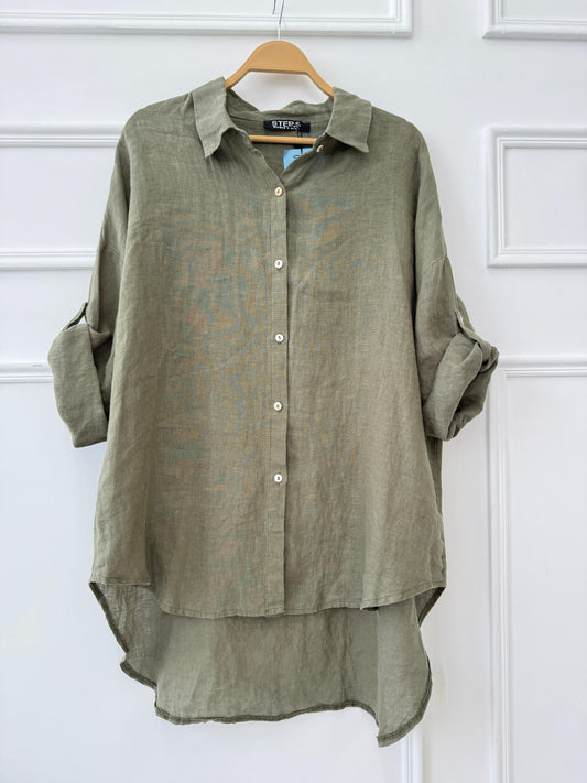 Amenaa linen shirt displayed on a hanger, featuring a lightweight, breathable fabric with a classic collar and button-down front.