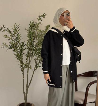 Amenaa Simple Snap Jacket in neutral fabric, featuring a clean design with snap closures and a modern, minimalist style.