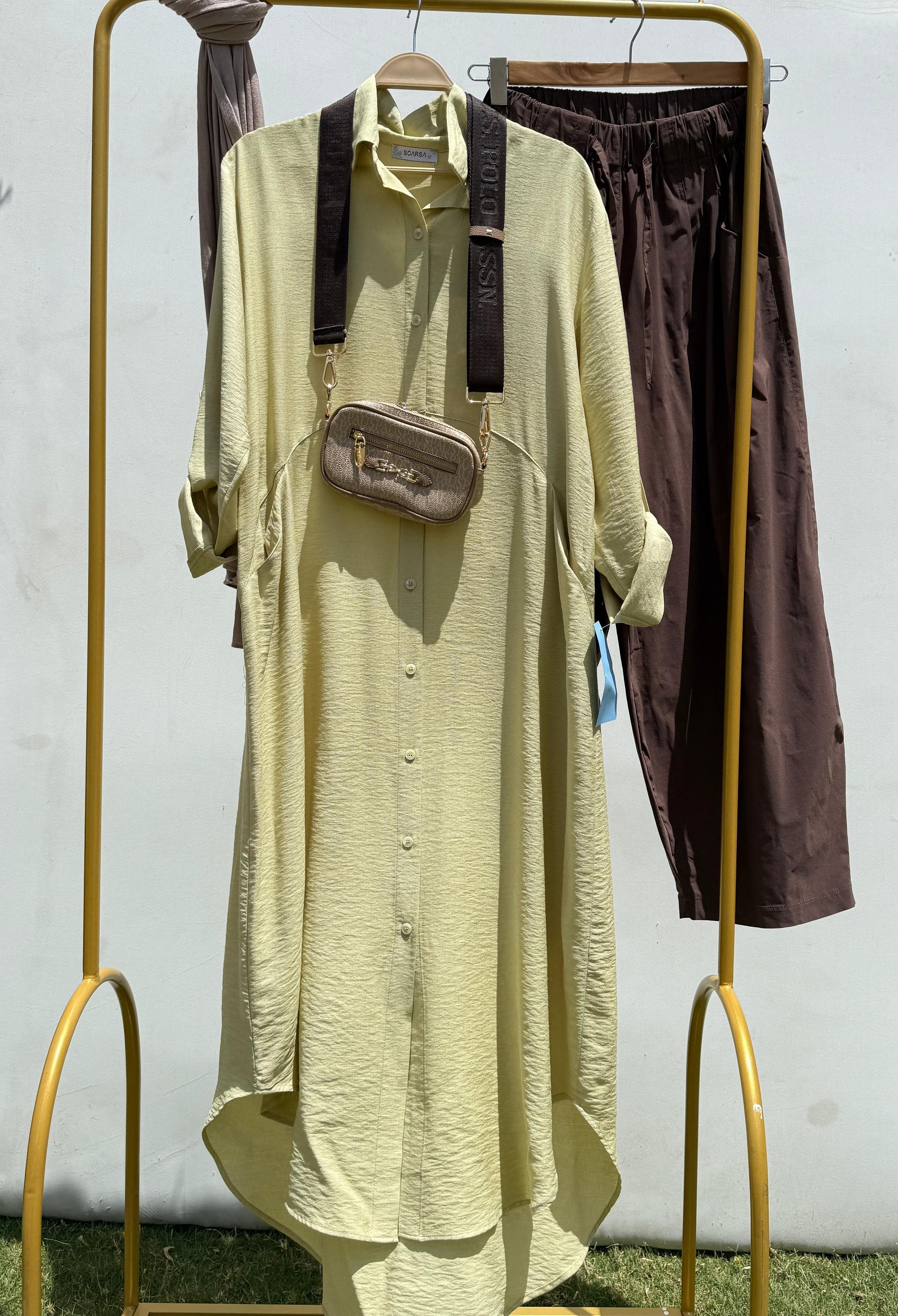 Amenaa shirt dress with a relaxed fit, featuring a button-down front and short sleeves, displayed on a neutral background.