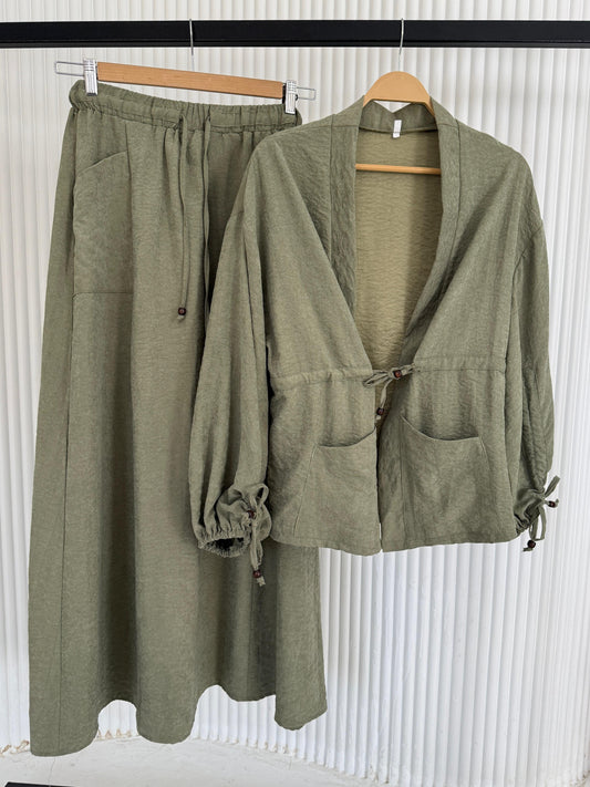 Amenaa modest skirt set featuring a long, flowing skirt and matching top in elegant, neutral tones.