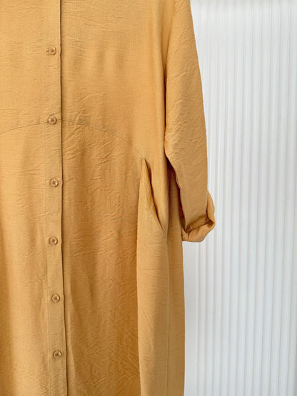 Amenaa shirt dress with long sleeves and a button-front design, featuring a casual and stylish look.