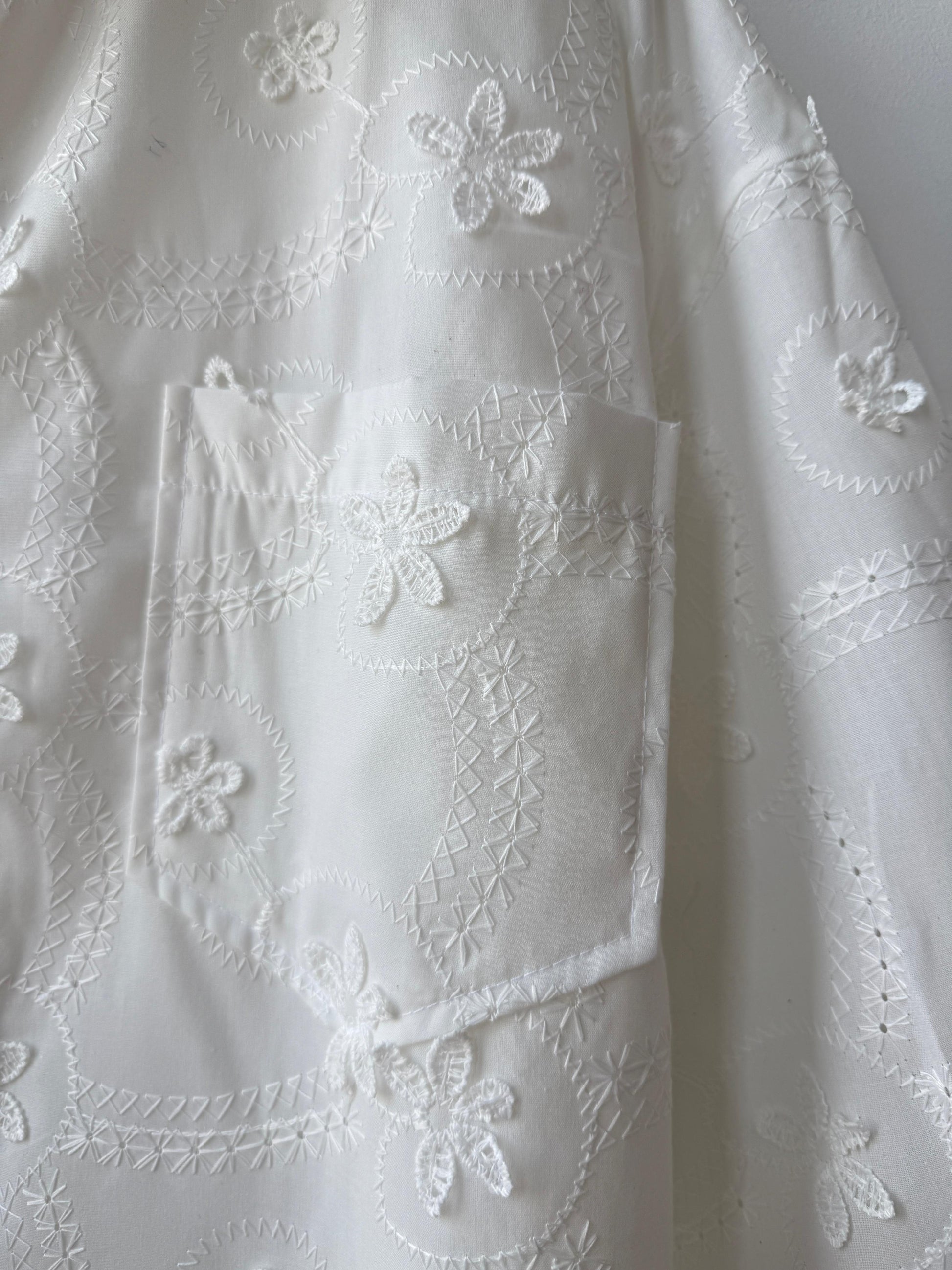 Amenaa floral embroidered shirt featuring colorful flower patterns on lightweight fabric, stylish and perfect for casual wear.