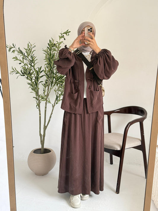 Amenaa Modest Set 27/12/1 featuring a stylish, modest outfit with layered fabrics and intricate details, worn by a model.
