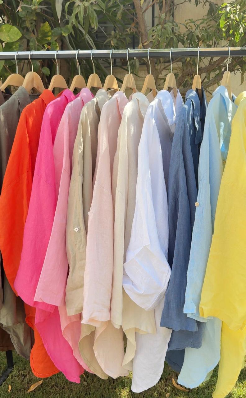 Amenaa linen shirt displayed on a hanger, featuring a lightweight, breathable fabric with a relaxed fit and classic collar design.