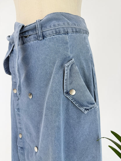 Amenaa button denim skirt with front buttons and classic denim wash, styled with a relaxed fit and casual design.