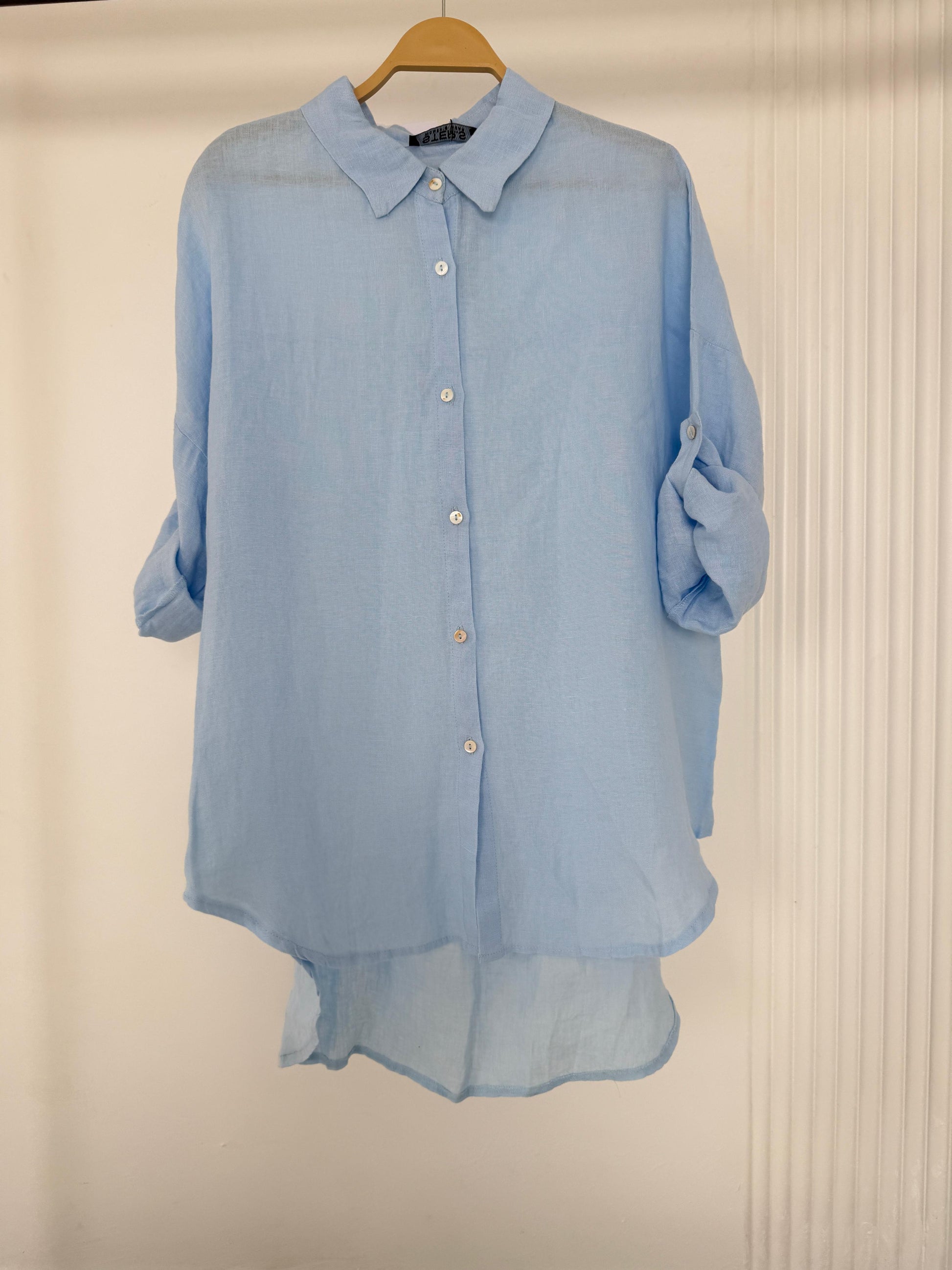 Light beige Amenaa linen shirt with a relaxed fit, featuring a classic collar and button-front design, displayed on a white background.