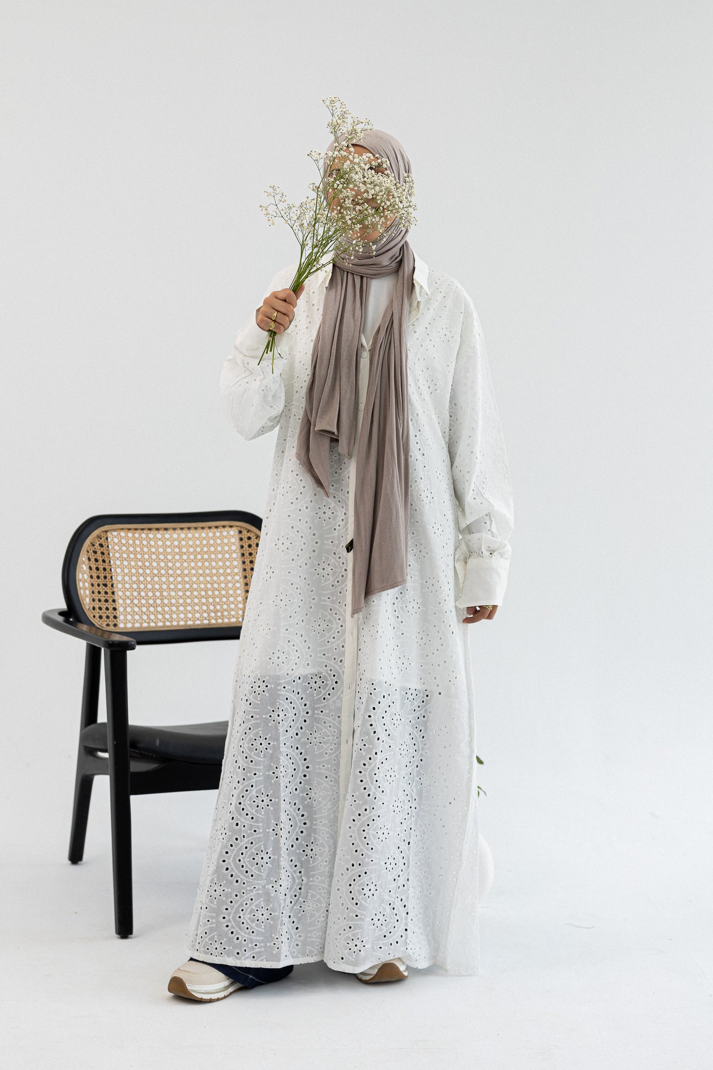 Amenaa Rokama shirt dress with long sleeves, button-up front, and a fitted waist, shown on a model.