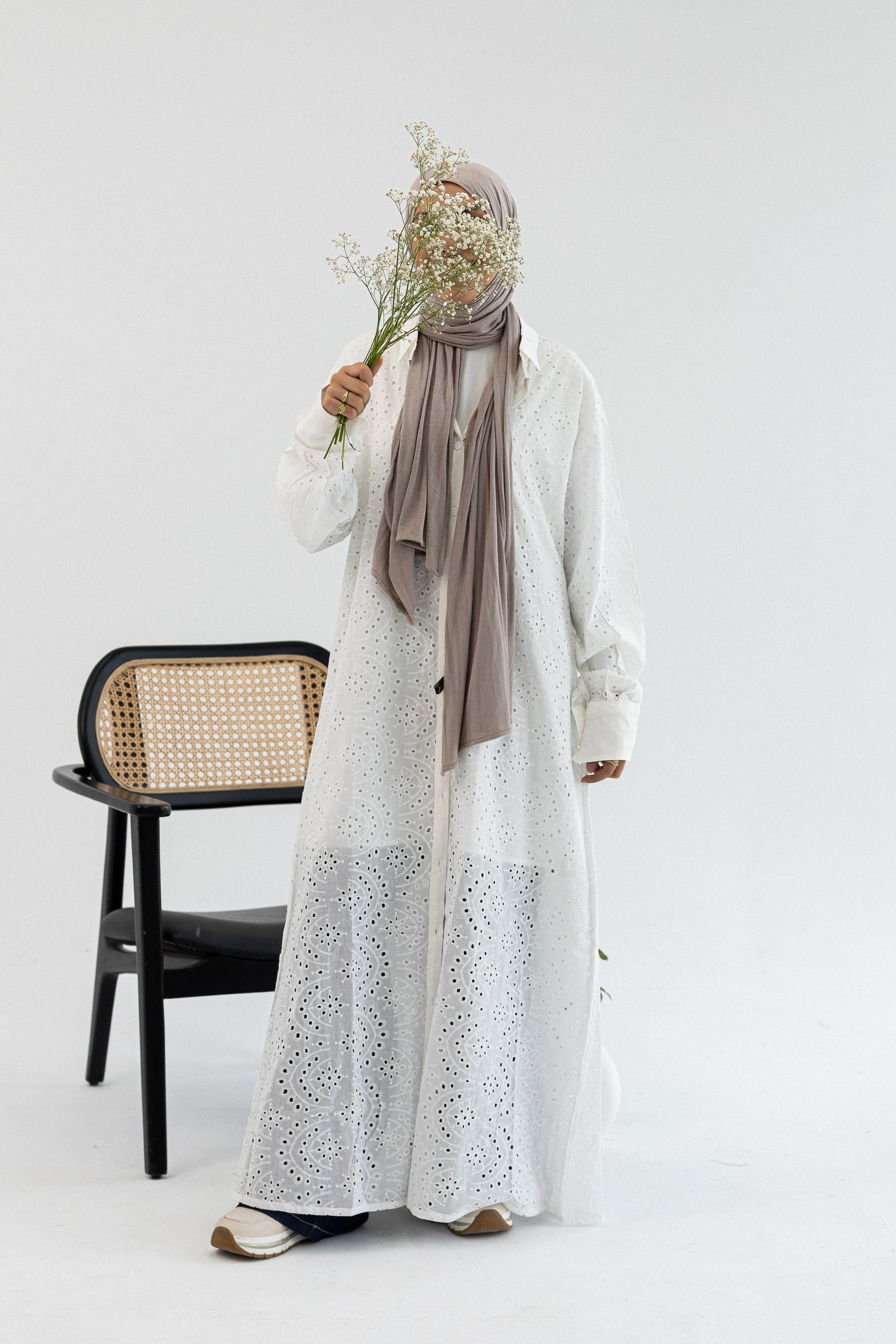 Amenaa Rokama shirt dress with long sleeves, button-up front, and a fitted waist, shown on a model.