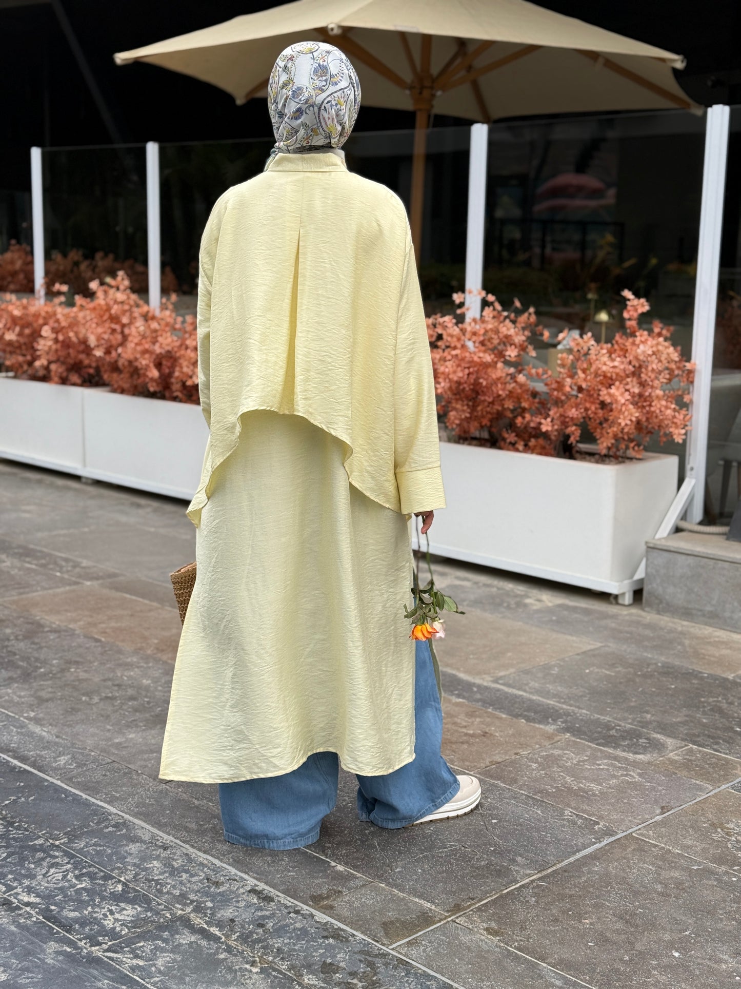 Amenaa high-low shirt dress featuring a flowing design with a collar and button front, perfect for casual or semi-formal wear.