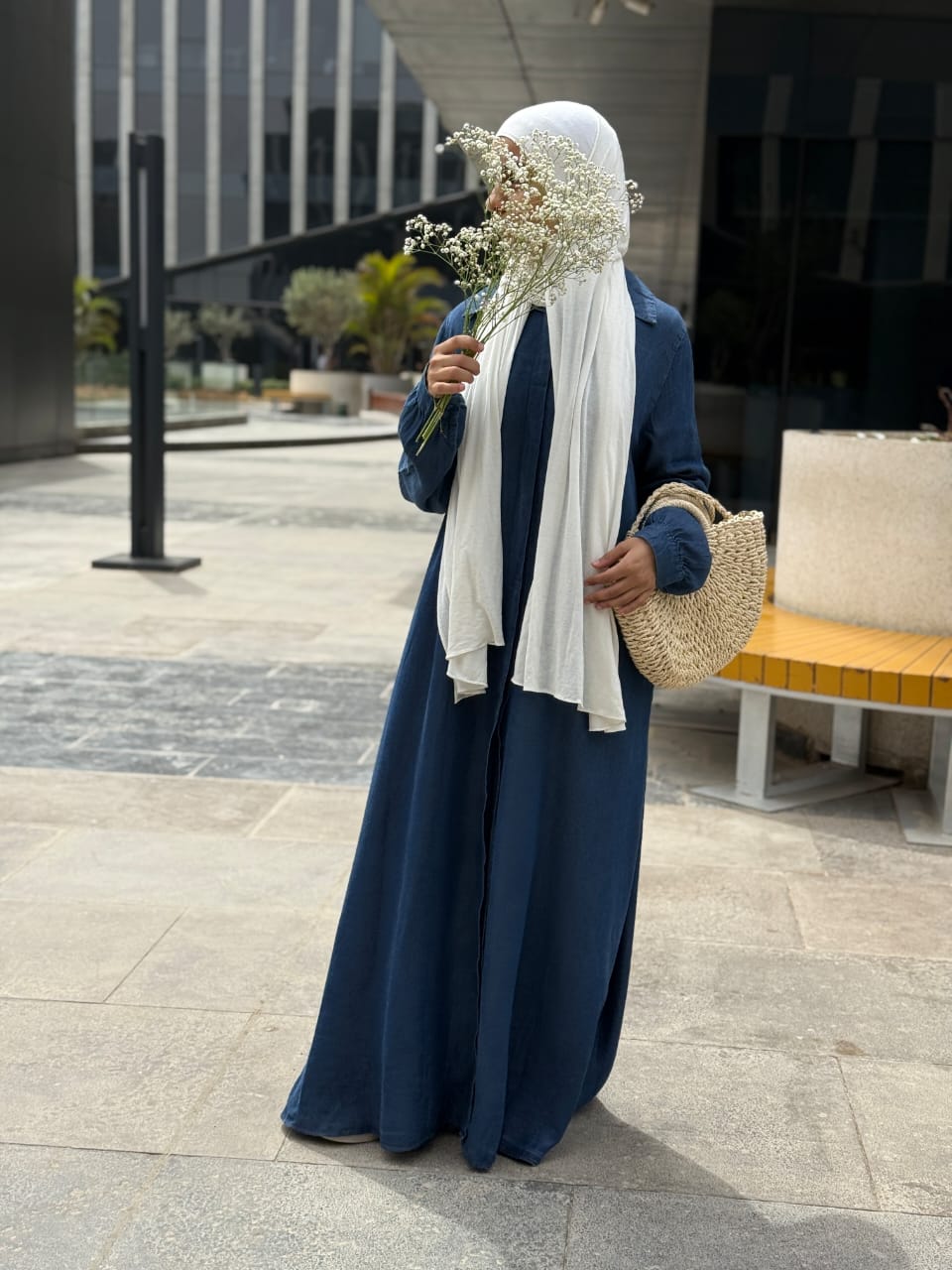 Amenaa maxi denim dress featuring a flowy silhouette, sleeveless design, and classic blue denim fabric.