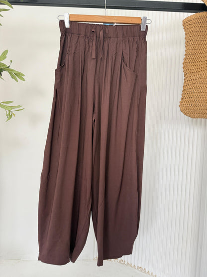 Amenaa balloon pants in lightweight fabric with a relaxed fit and elastic waistband, shown in a neutral color.