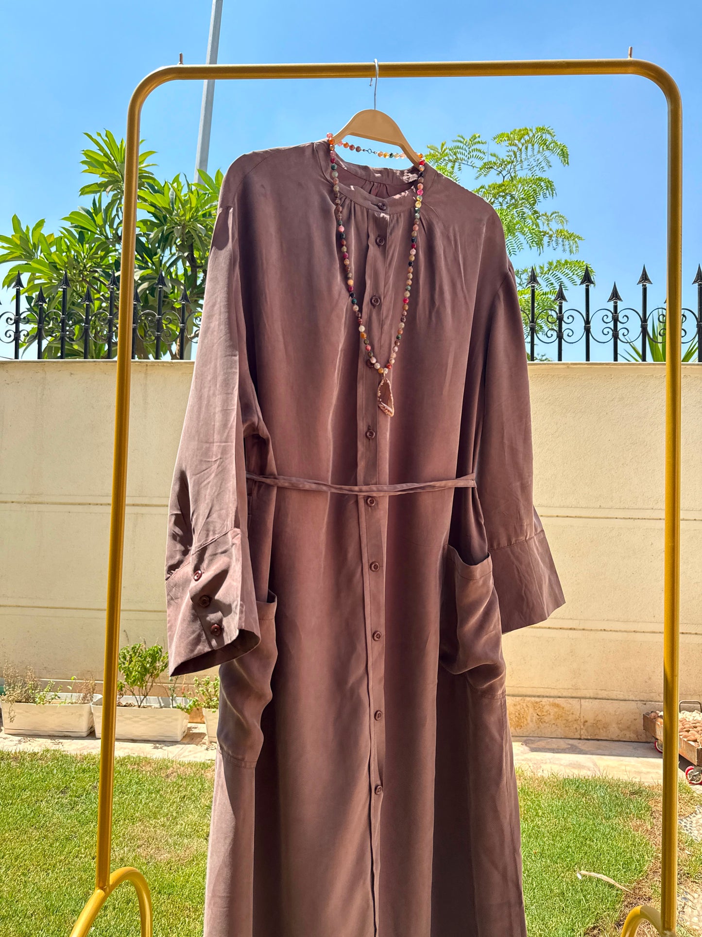 Elegant black modest abaya by Amenaa, featuring flowing fabric and subtle detailing, perfect for modest fashion occasions.