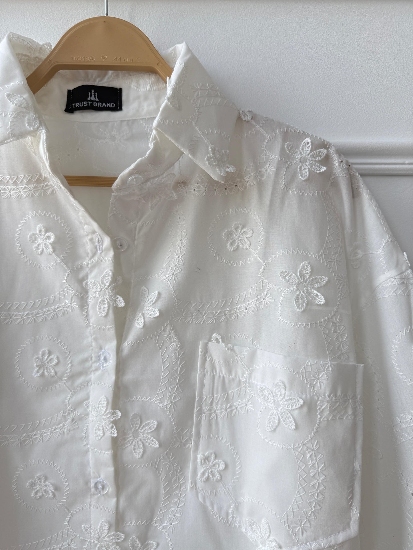 Floral embroidered Amenaa shirt featuring colorful floral patterns on a light fabric, casual and stylish for everyday wear.