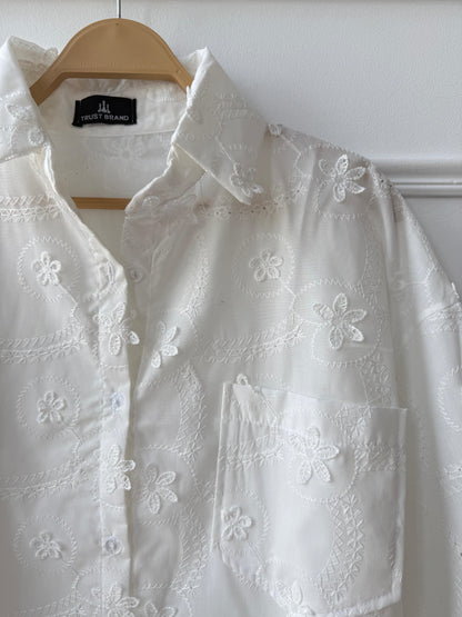 Floral embroidered Amenaa shirt featuring colorful floral patterns on a light fabric, casual and stylish for everyday wear.