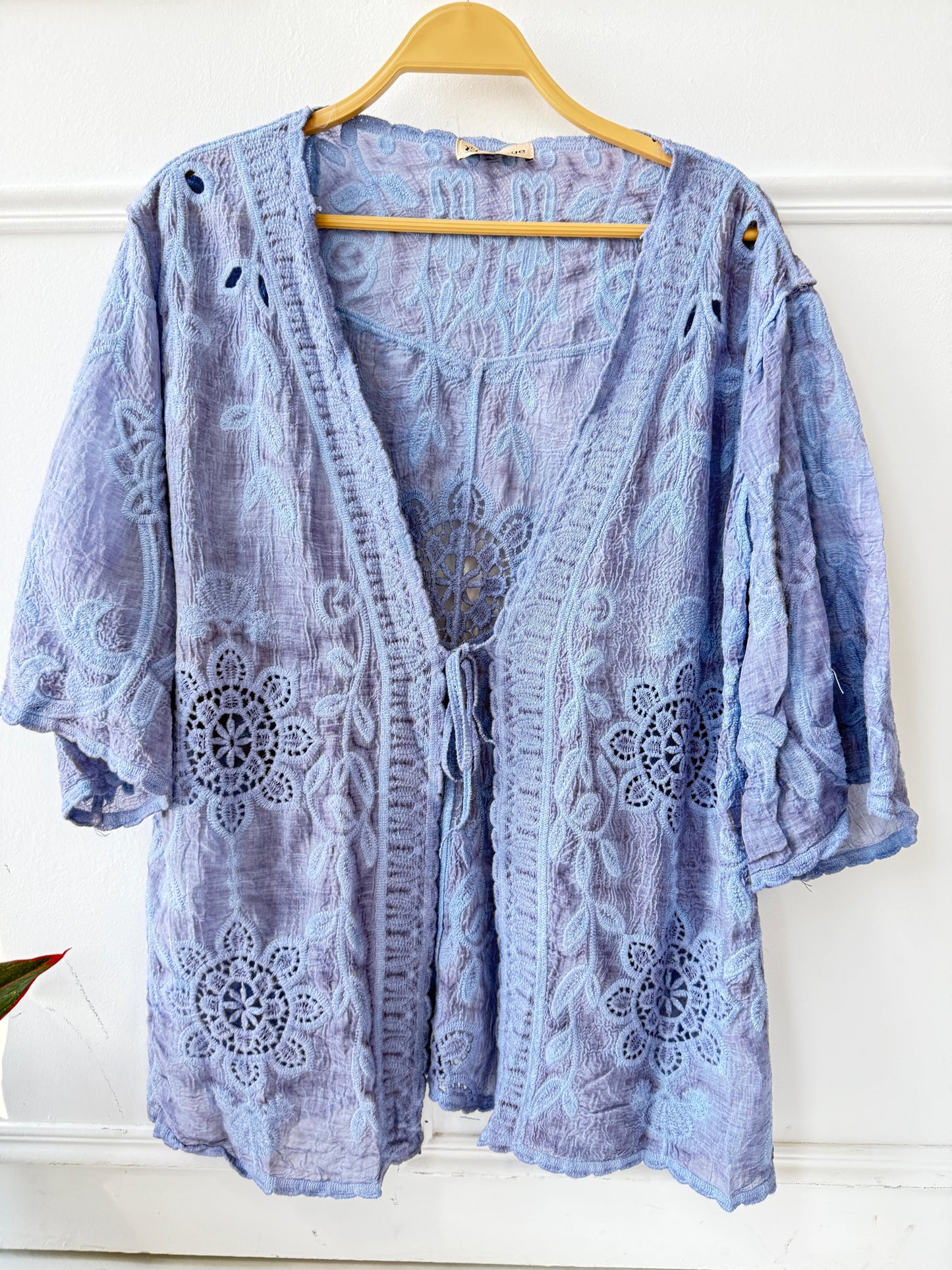 Embroidered lace kimono by Amenaa featuring delicate floral embroidery and lightweight, sheer fabric for a stylish layered look.