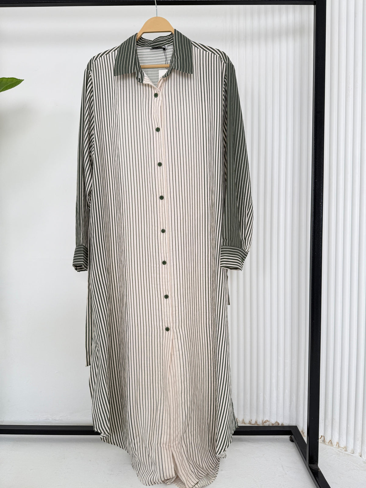 Amenaa long striped shirt, lightweight and casual, featuring vertical blue and white stripes and a relaxed fit.