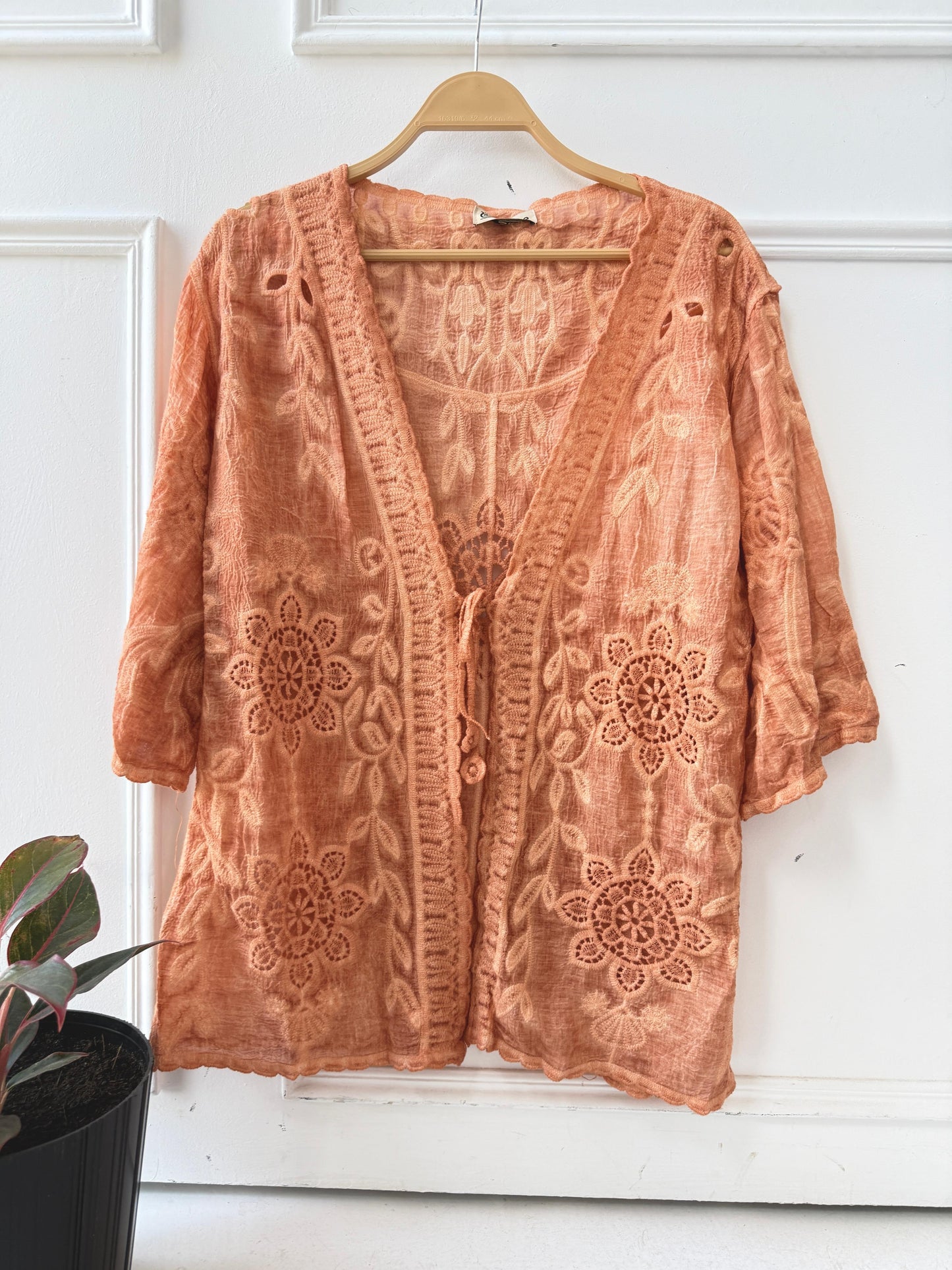 Elegant embroidered lace kimono by Amenaa featuring intricate floral patterns and delicate fabric details.