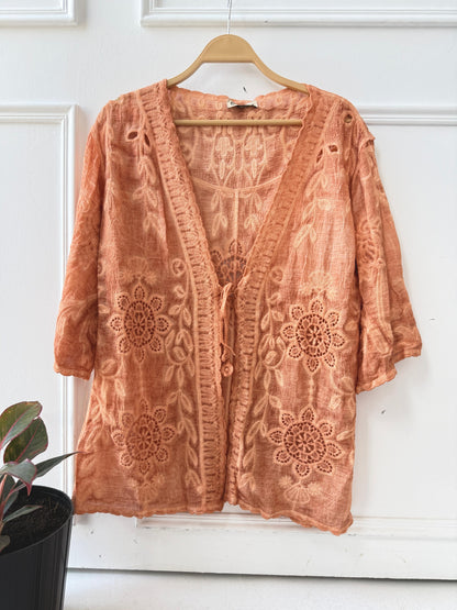 Elegant embroidered lace kimono by Amenaa featuring intricate floral patterns and delicate fabric details.