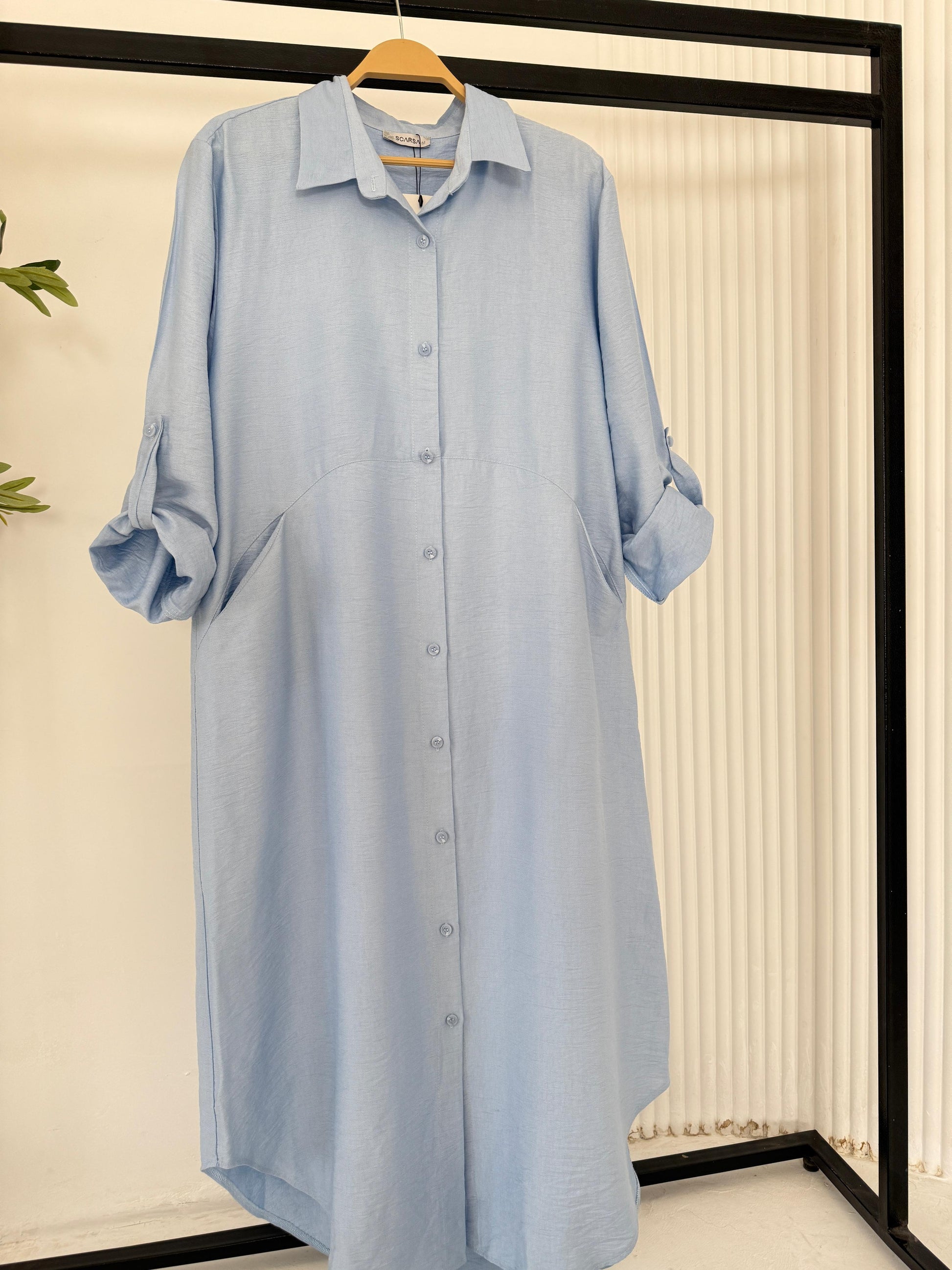 Amenaa shirt dress featuring a stylish, casual design with a collar, long sleeves, and a relaxed fit.