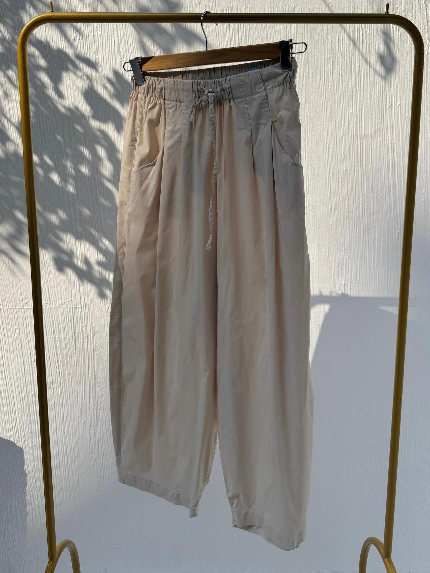 Amenaa balloon pants with a relaxed fit, featuring a high waist and wide leg design, shown in a casual style.
