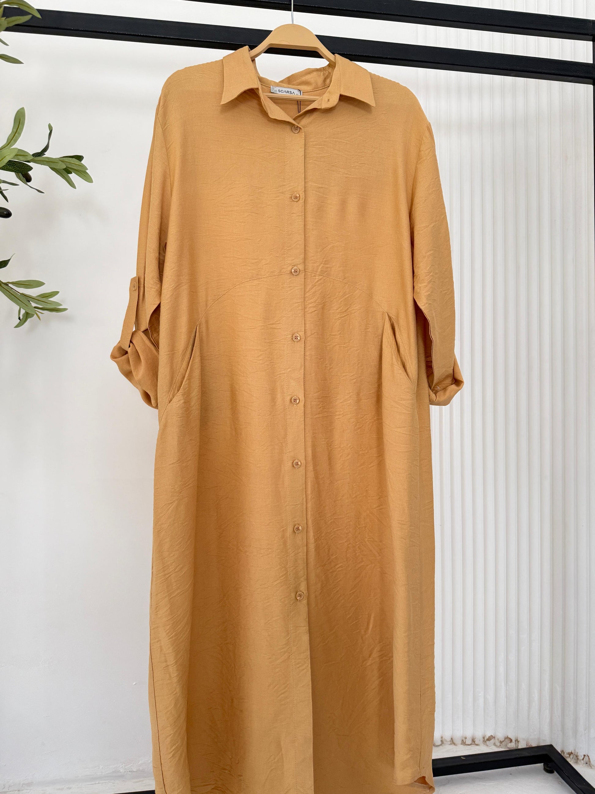 Amenaa shirt dress in lightweight fabric, featuring a relaxed fit and button-down front, perfect for casual or office wear.