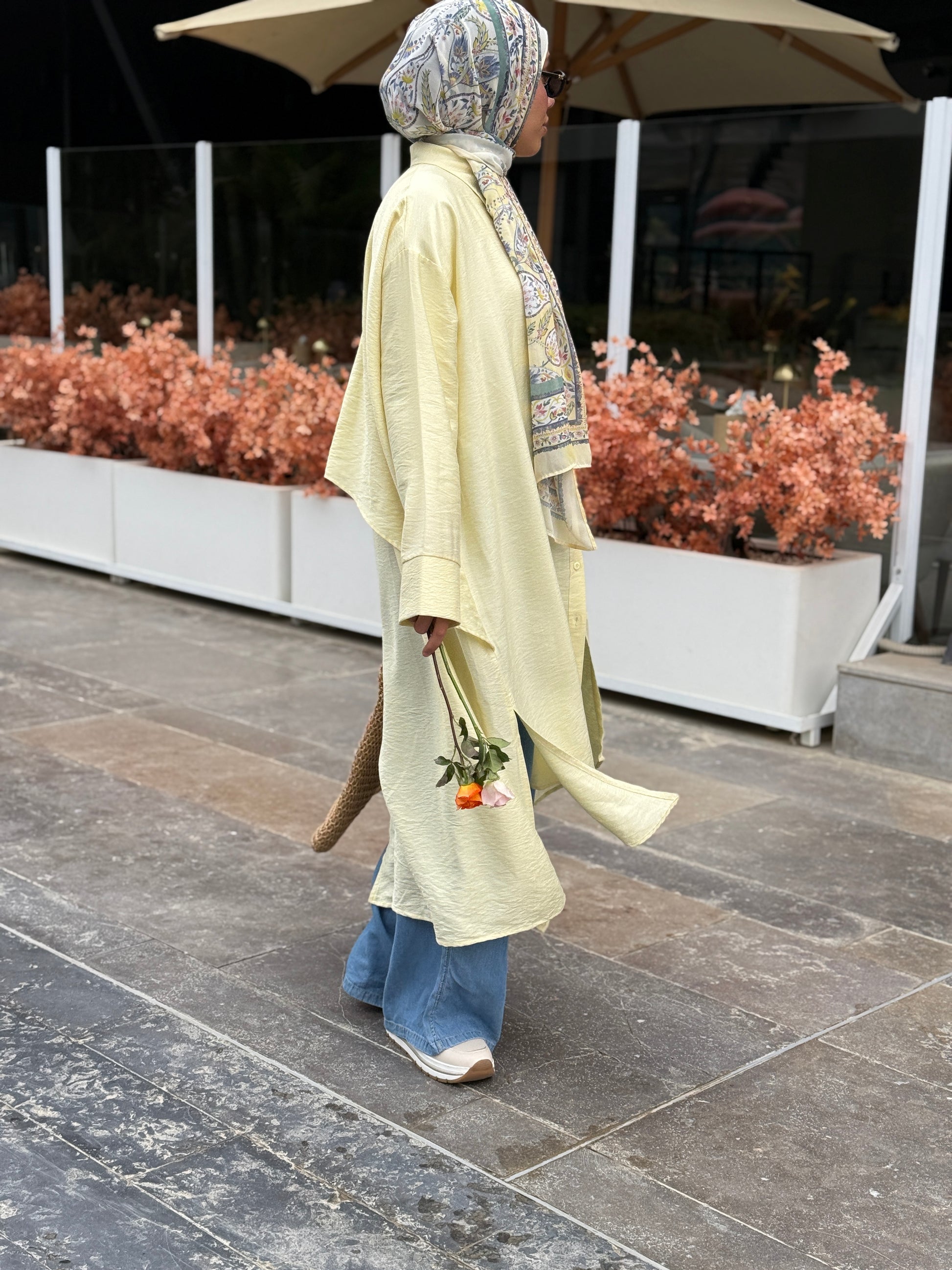 Amenaa high-low shirt dress displayed on a hanger with button details and a relaxed fit, perfect for casual or semi-formal wear.