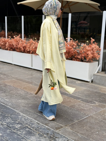 Amenaa high-low shirt dress displayed on a hanger with button details and a relaxed fit, perfect for casual or semi-formal wear.