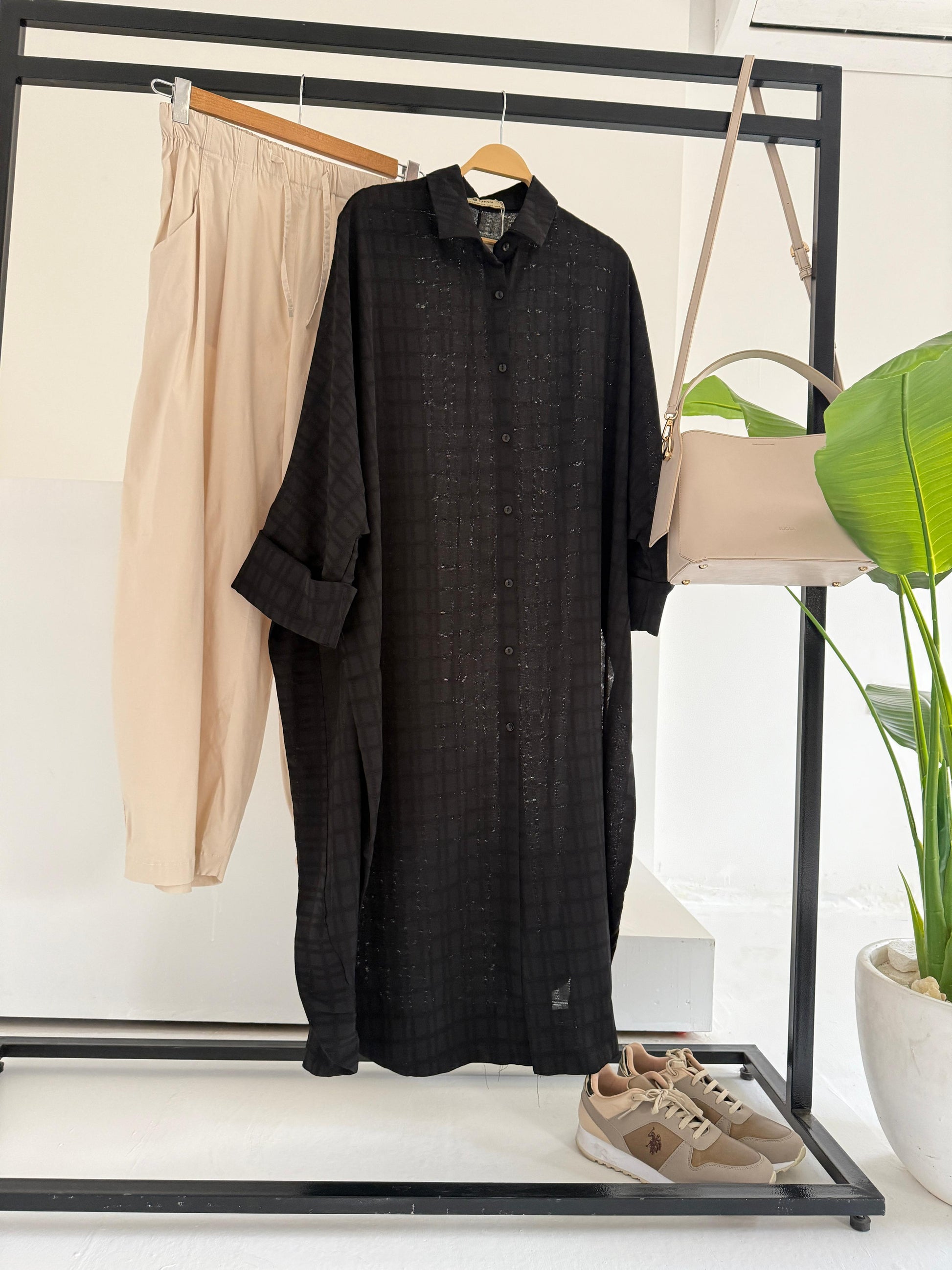 Amenaa textured oversized shirt dress displayed on a model, featuring a relaxed fit, long sleeves, and a stylish collar.