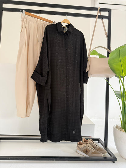 Amenaa textured oversized shirt dress displayed on a model, featuring a relaxed fit, long sleeves, and a stylish collar.
