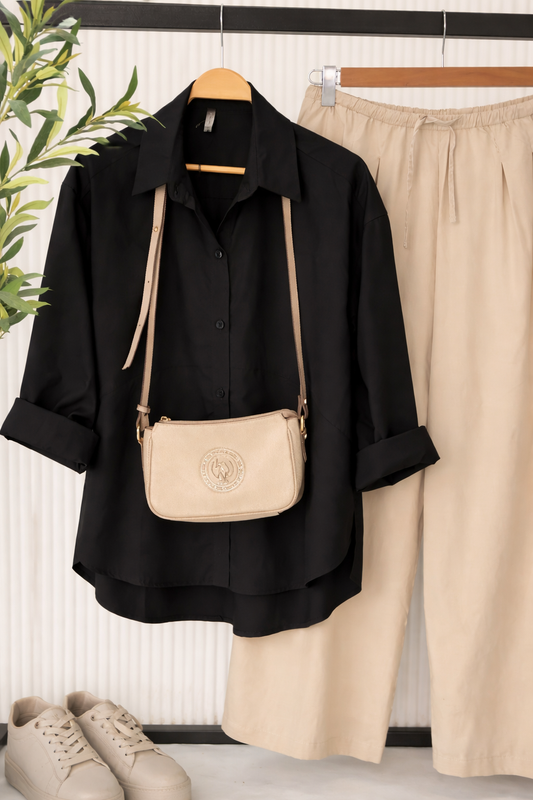 Oversized Amenaa poplin shirt in light fabric, shown in a relaxed fit with a classic collar and button-front design.