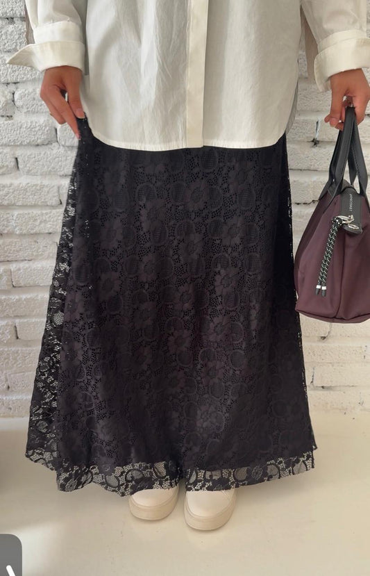 Black Guipure skirt by Amenaa featuring intricate lace fabric and a fitted, stylish design perfect for elegant outfits.