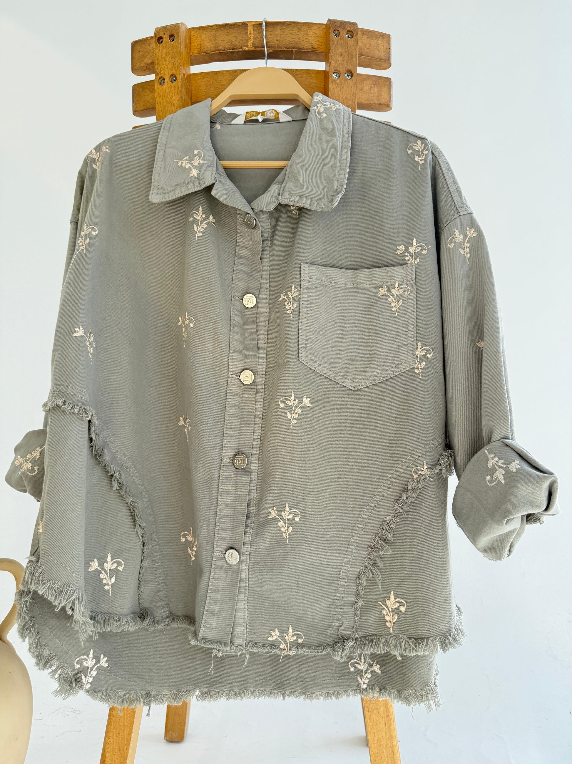 Amenaa flowery embroidered gabardine jacket with colorful floral patterns and tailored fit, captured on a model.