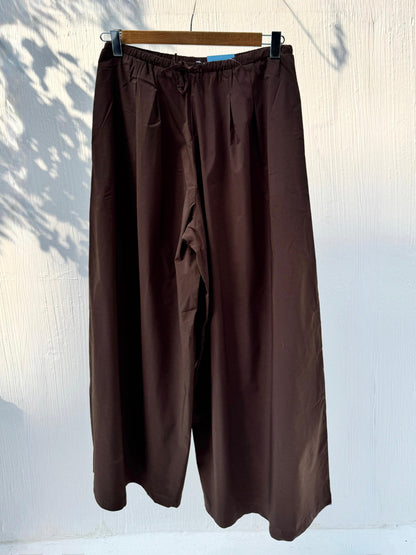 Amenaa wide leg pants in neutral fabric, featuring a relaxed fit and flowing silhouette, perfect for casual or stylish wear.