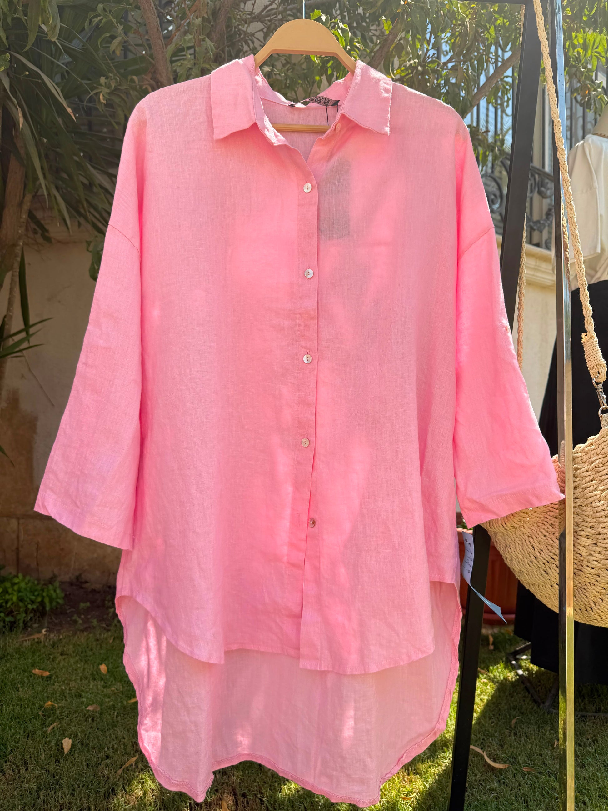Amenaa linen shirt displayed on a hanger with a relaxed fit and natural fabric texture, perfect for casual and warm weather wear.