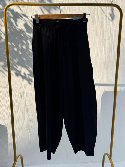 Amenaa balloon pants featuring a loose, oversized fit with a gathered waistband and wide-legged silhouette.