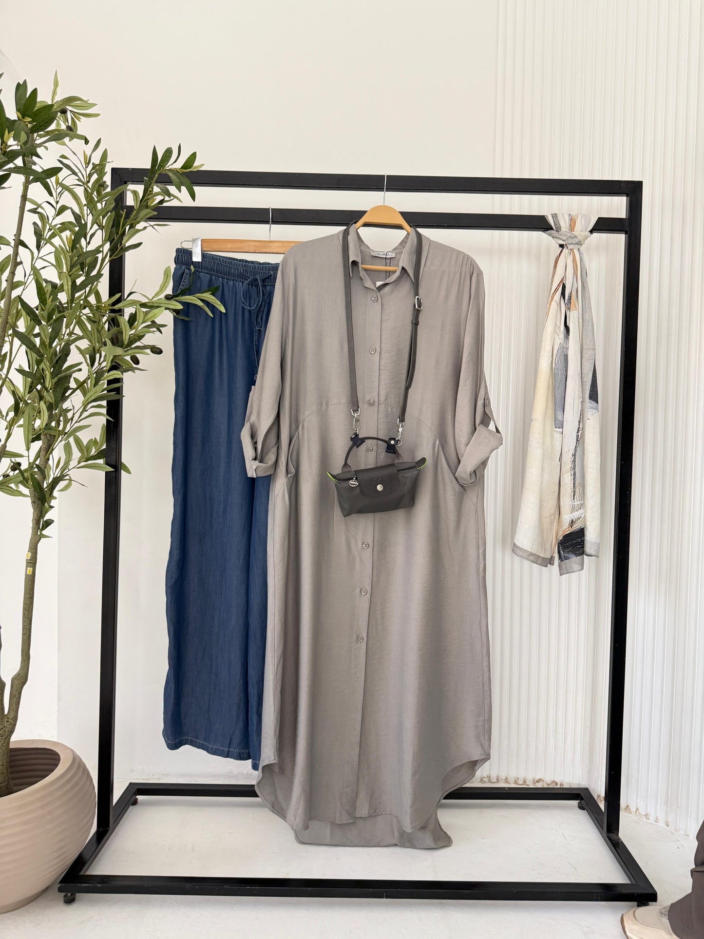 Amenaa shirt dress with a relaxed fit, featuring a button-down front and collar, in a casual, stylish design.