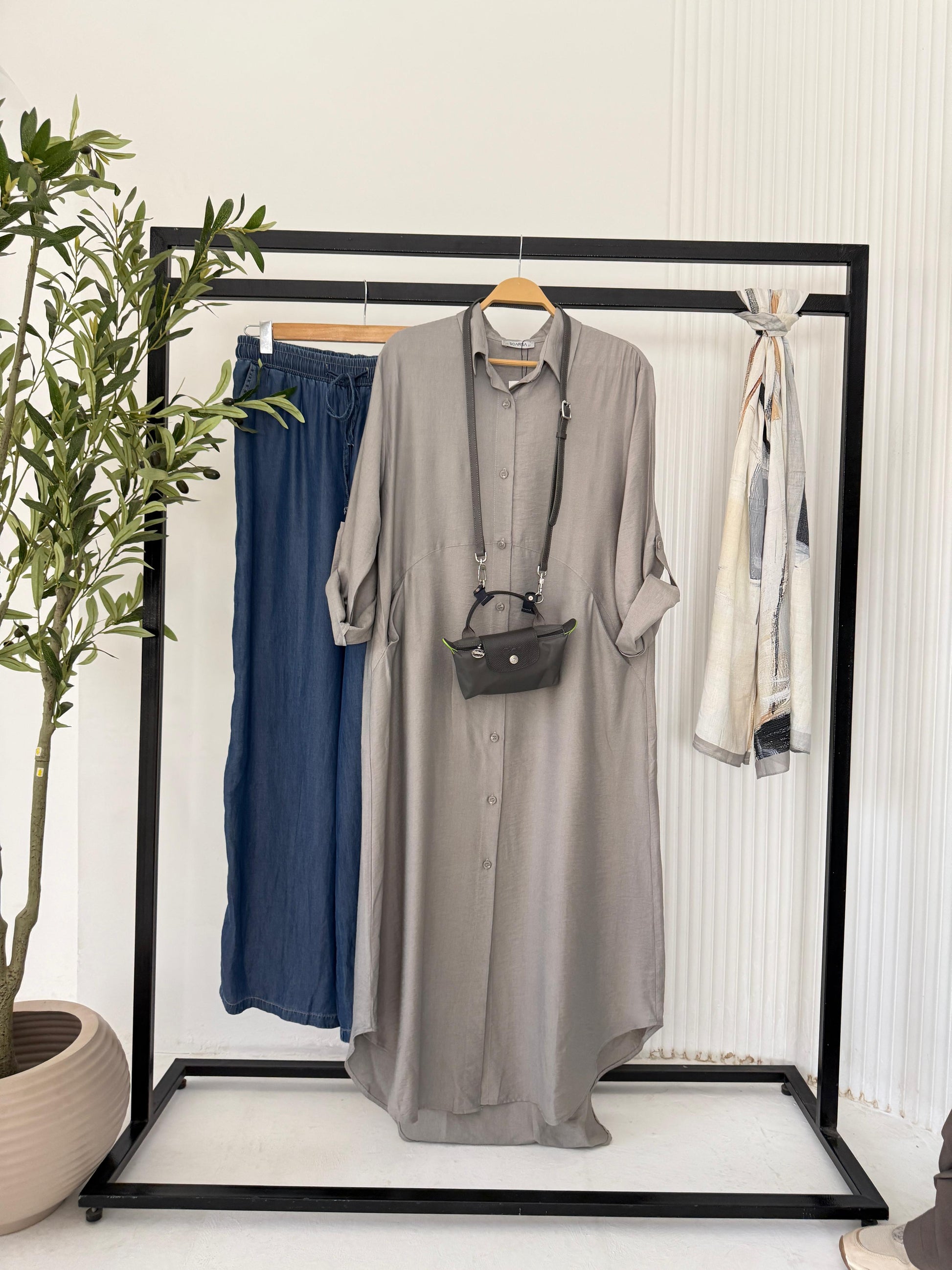 Amenaa shirt dress with a relaxed fit, featuring a button-down front and collar, in a casual, stylish design.