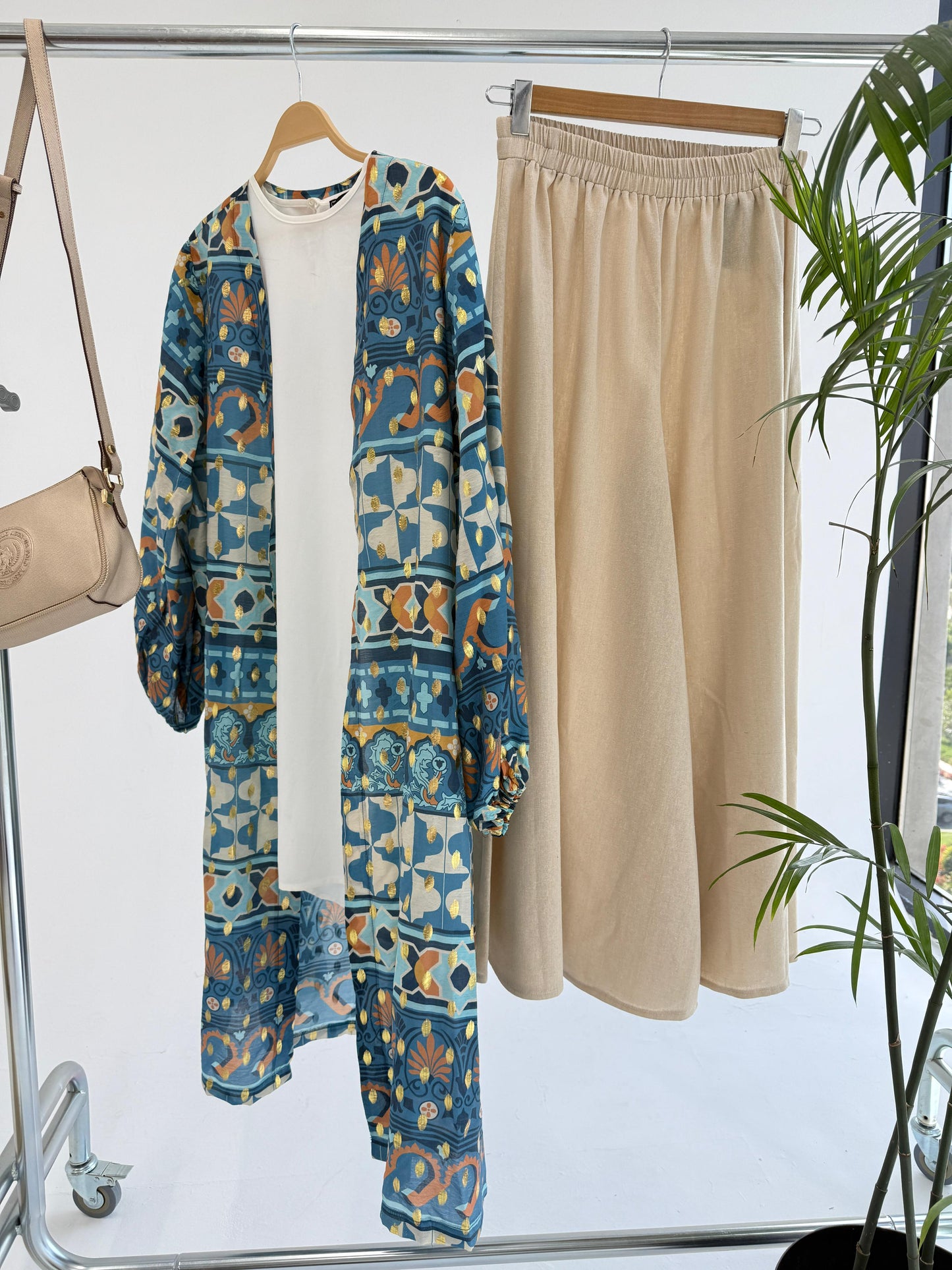 Amenaa mosaic pattern kimono with vibrant geometric designs, flowing fabric, and wide sleeves for a stylish, bohemian look.